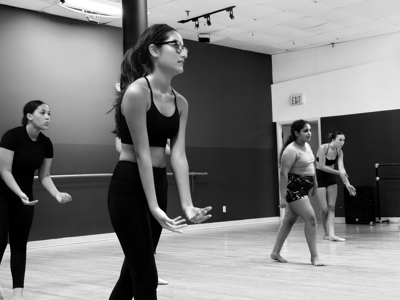 A dancer marking choreography in class