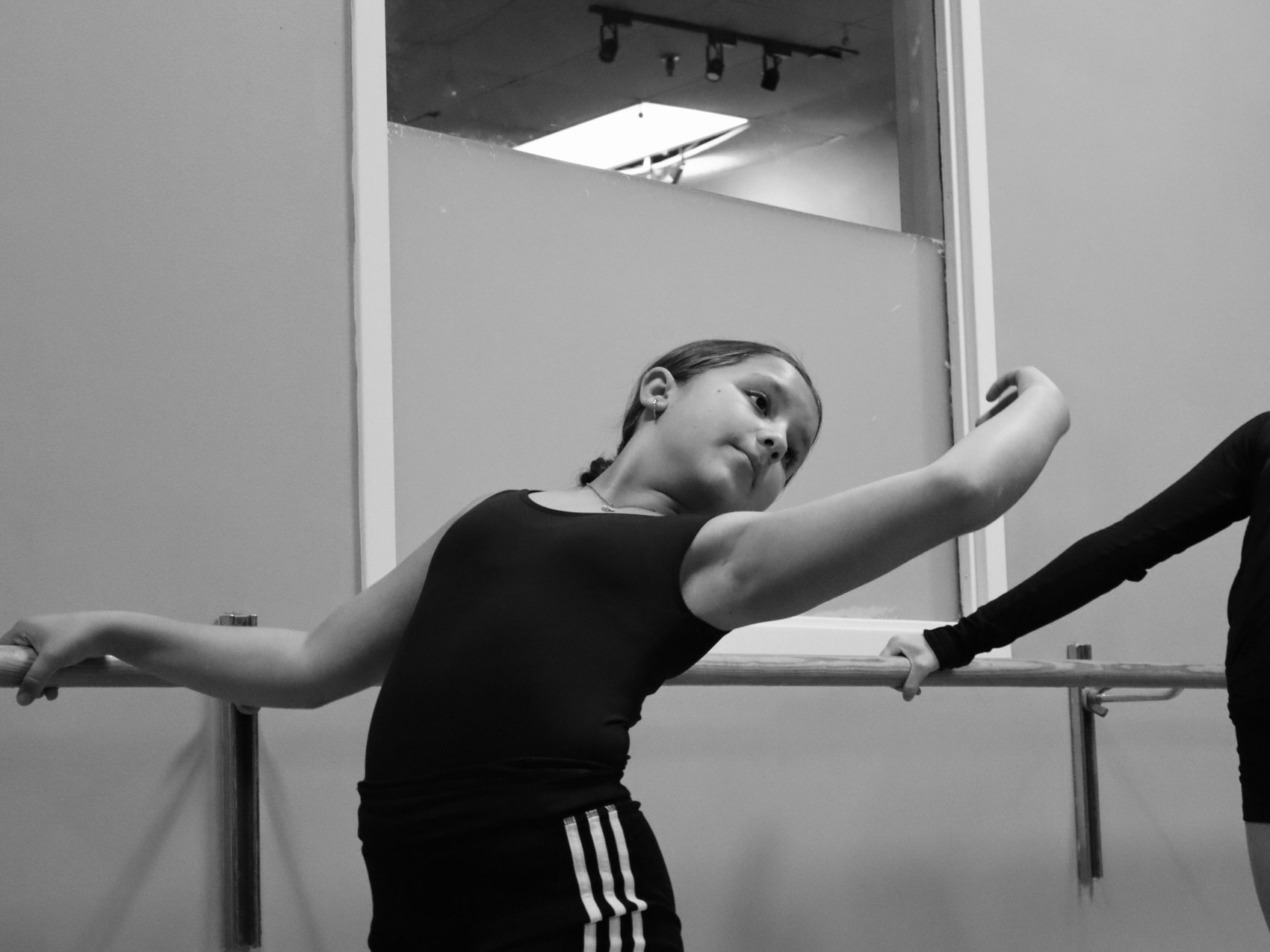 A young dancer at the barre at Impact Studios